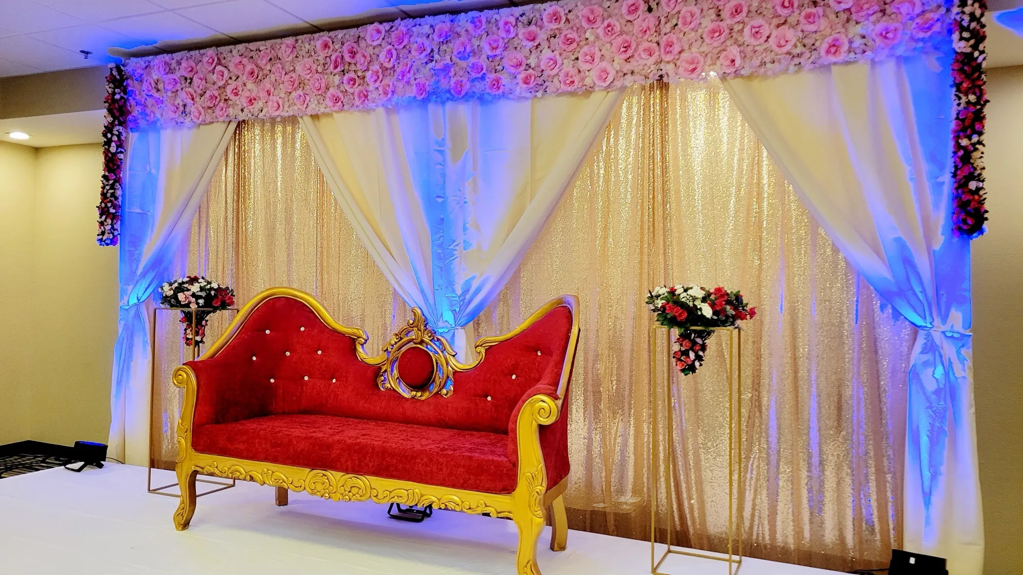 Reception stage red loveseat sequin — Sequin Drapes & Red Loveseat Reception