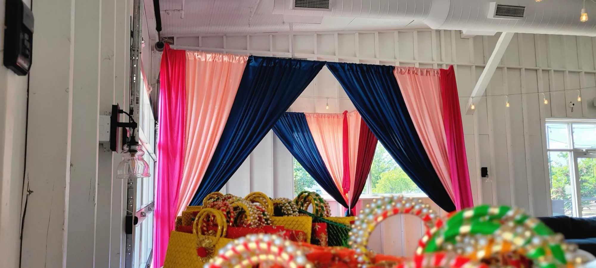 Colorful tassel garland closeup — Colorful Sangeet Stage with Diwan & Elephants