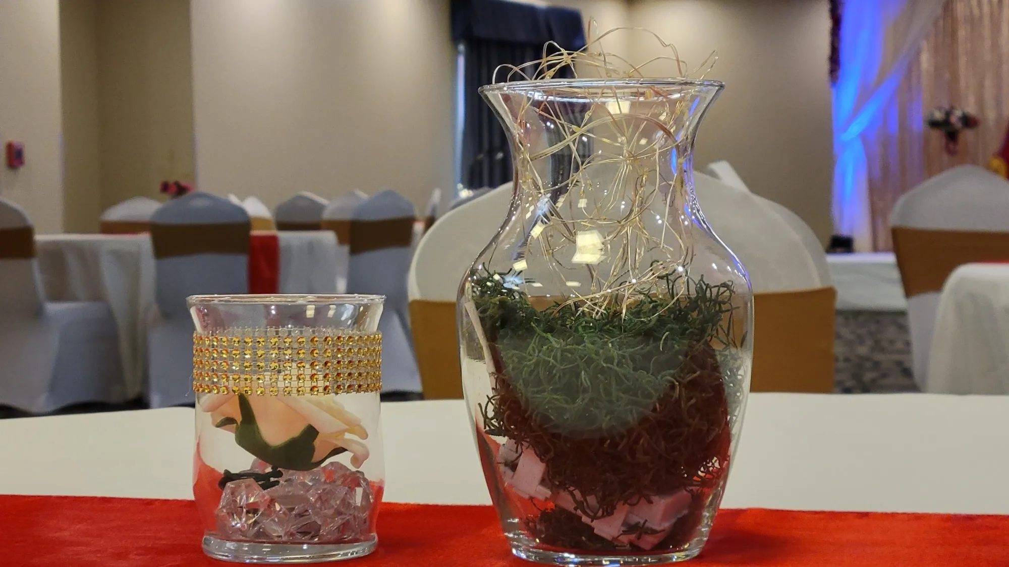 Venue overview tables drapes — Sequin Drapes & Red Loveseat Reception